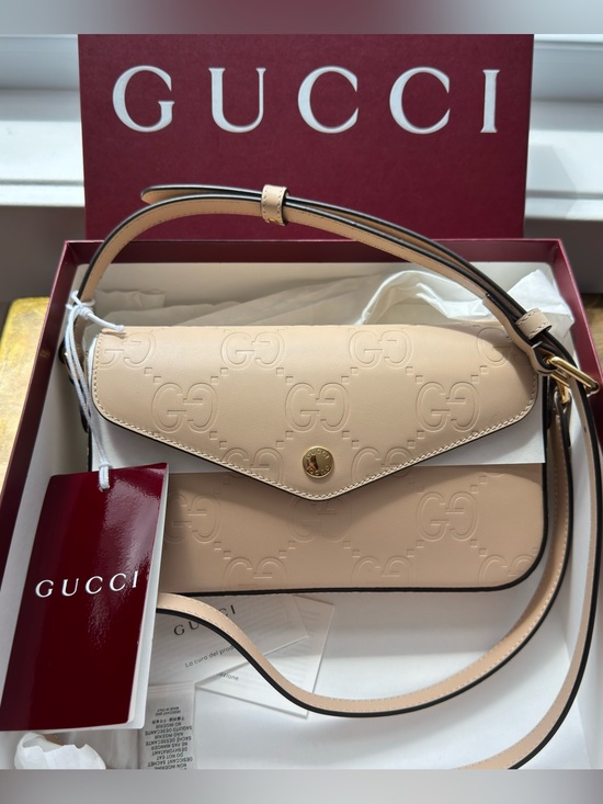 Gucci Handbags - Gucci Embossed GG Super Mini Beige Leather Shoulder Bag